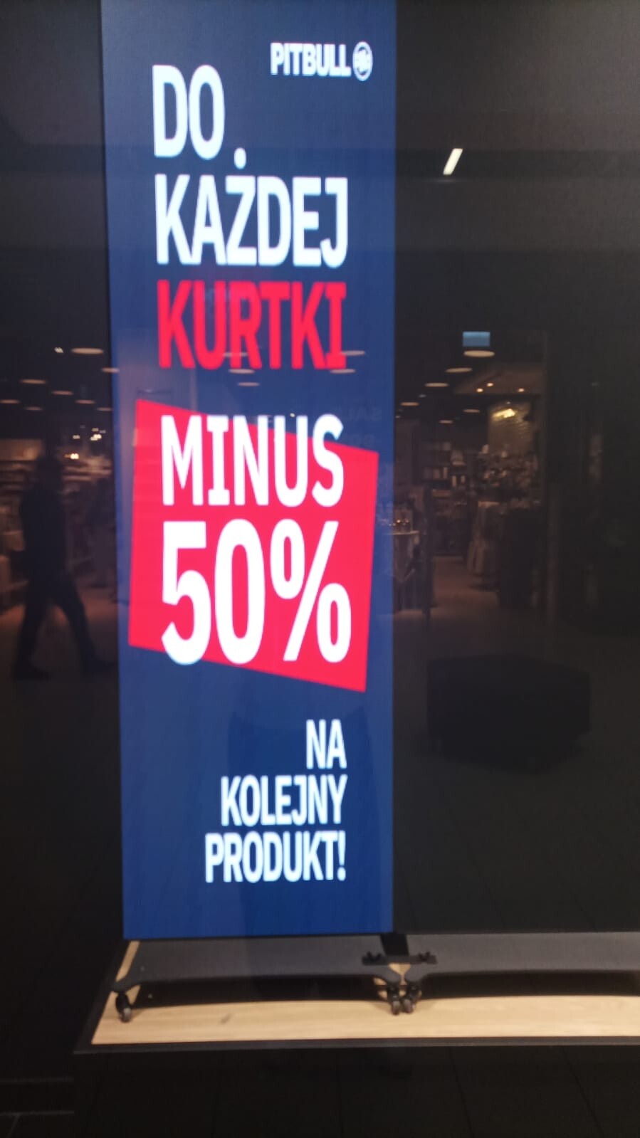 Freestanding LED totem digital poster in a retail shop