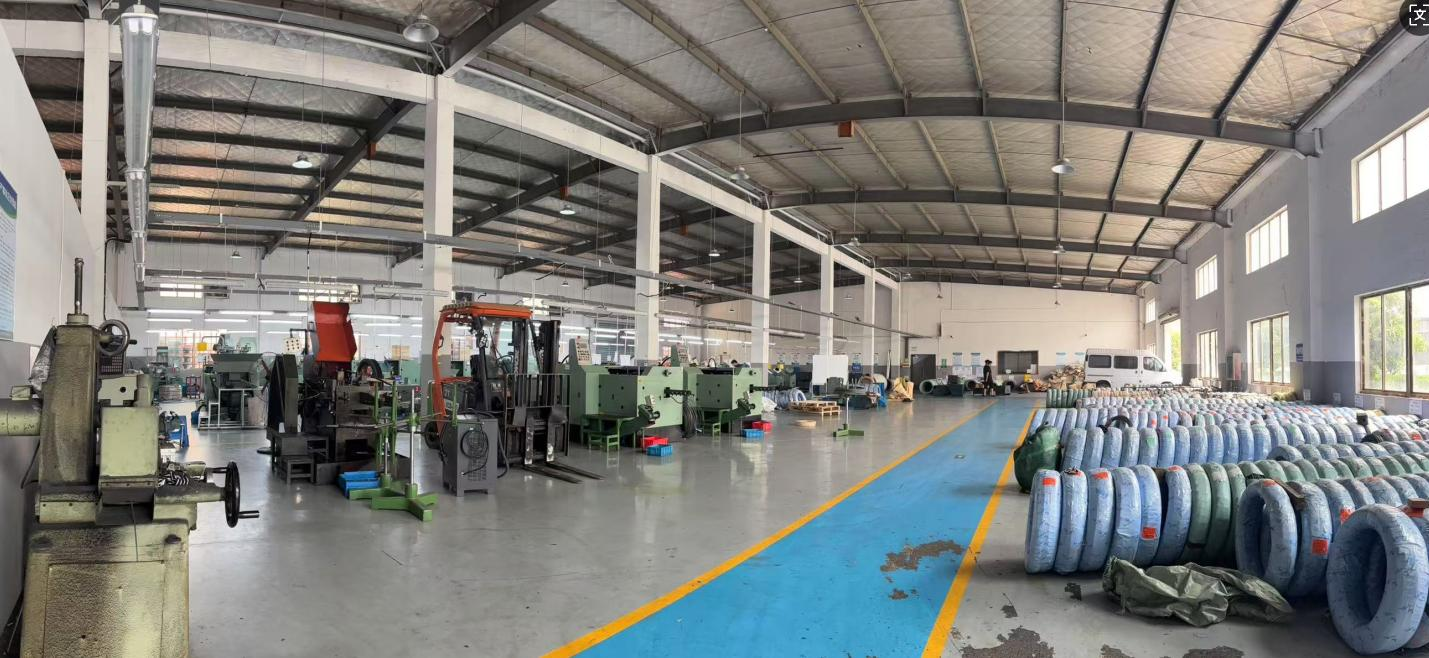 Factory Workshop with Cold Heading Machines and Steel Wire Coils