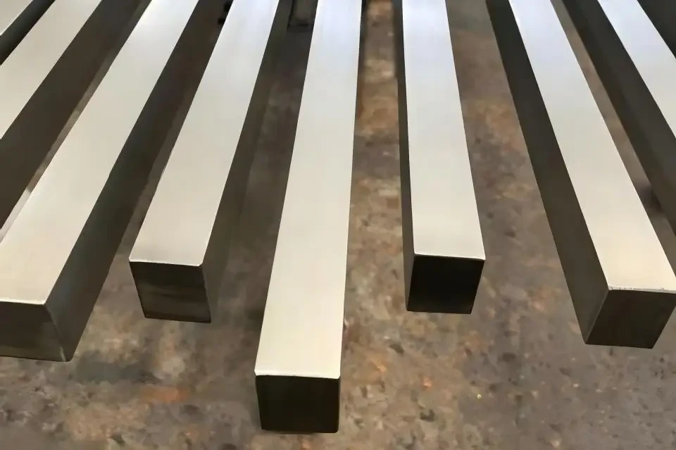 Close-up of stacked square steel