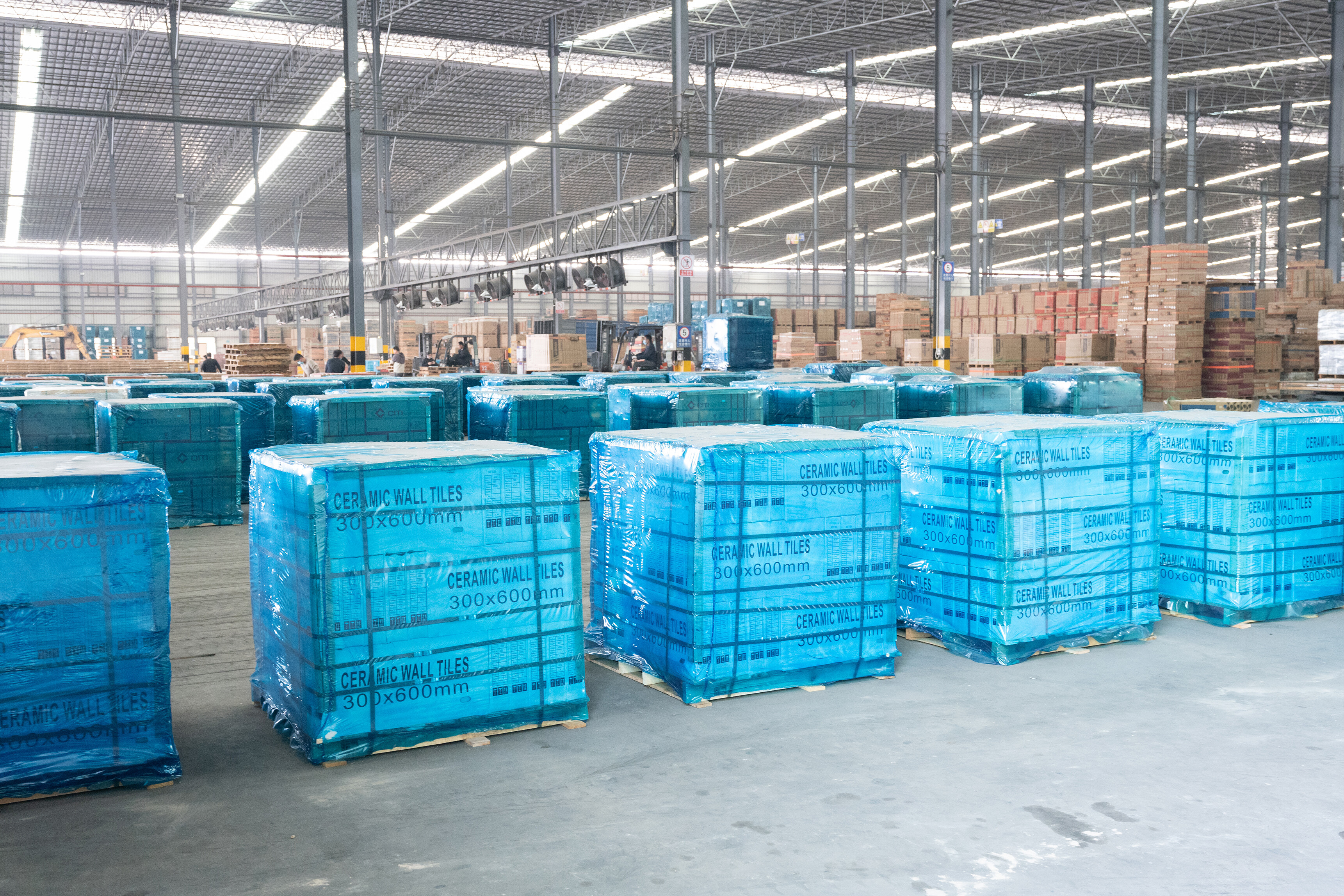 Warehouse with blue-wrapped ceramic wall tile pallets