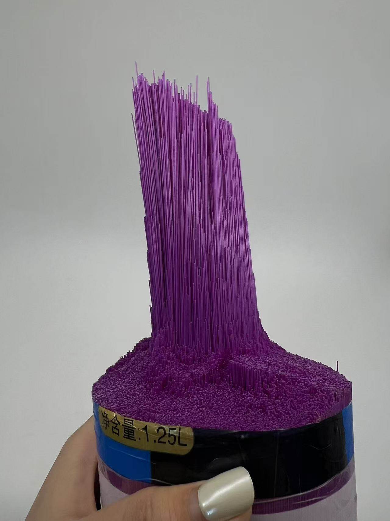 Purple plastic filament broom head