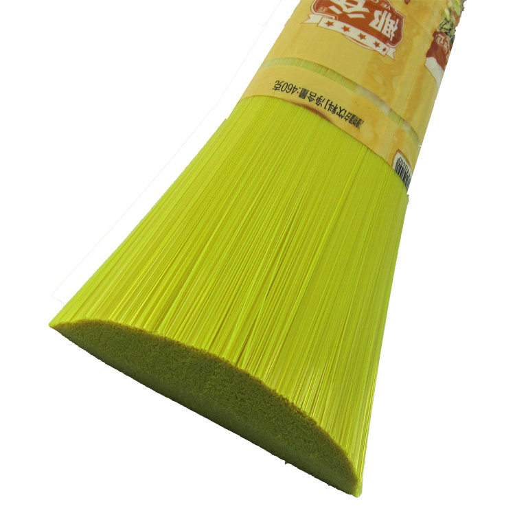 Yellow-green plastic bristle broom head