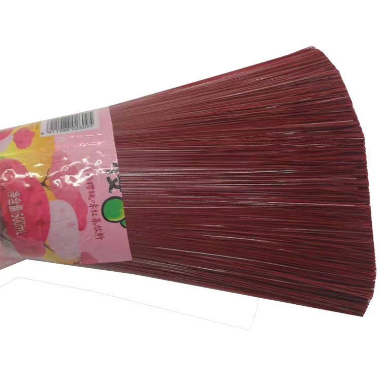 Red plastic filament broom head