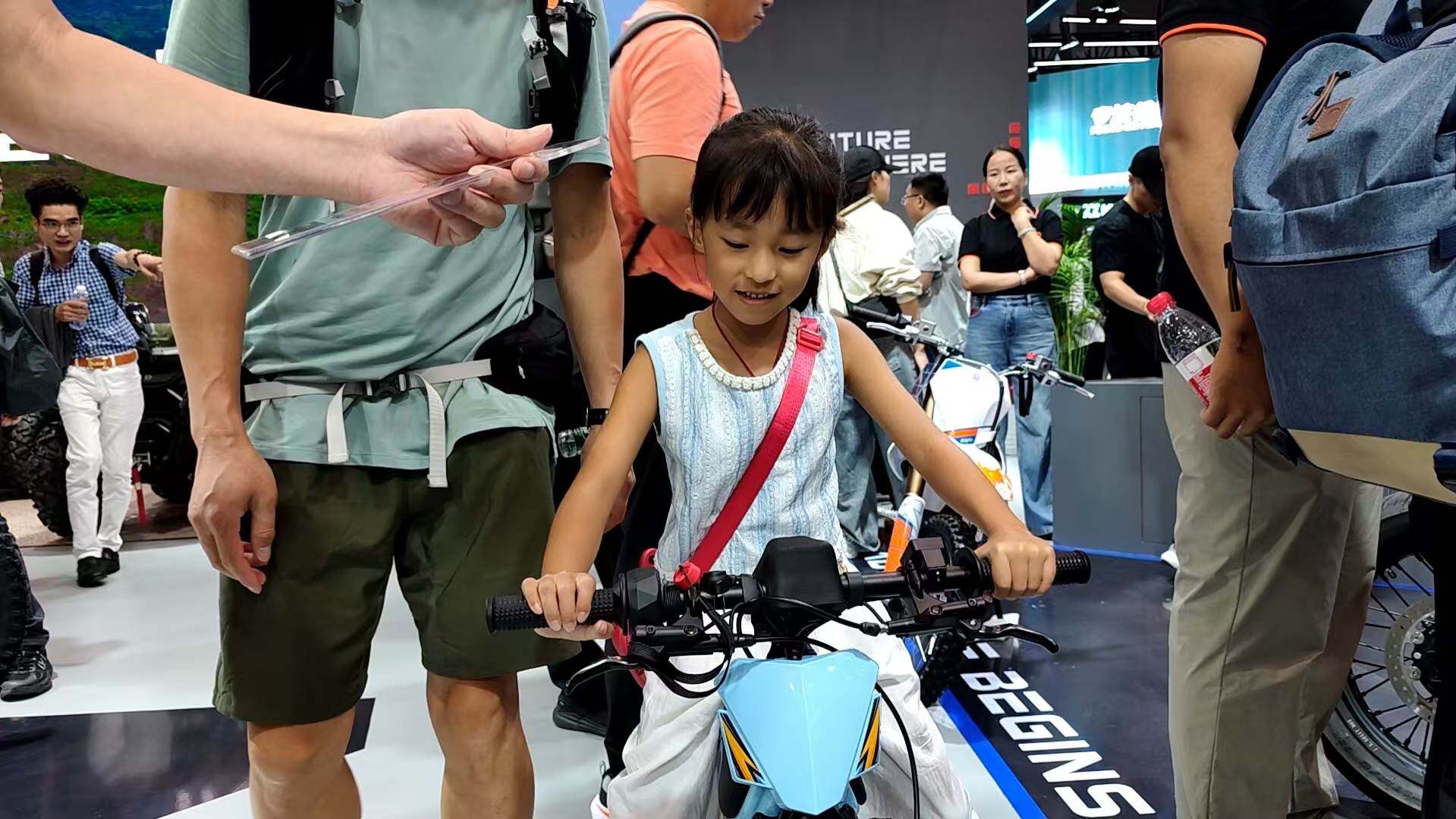Families visiting and engaging at the exhibition booth