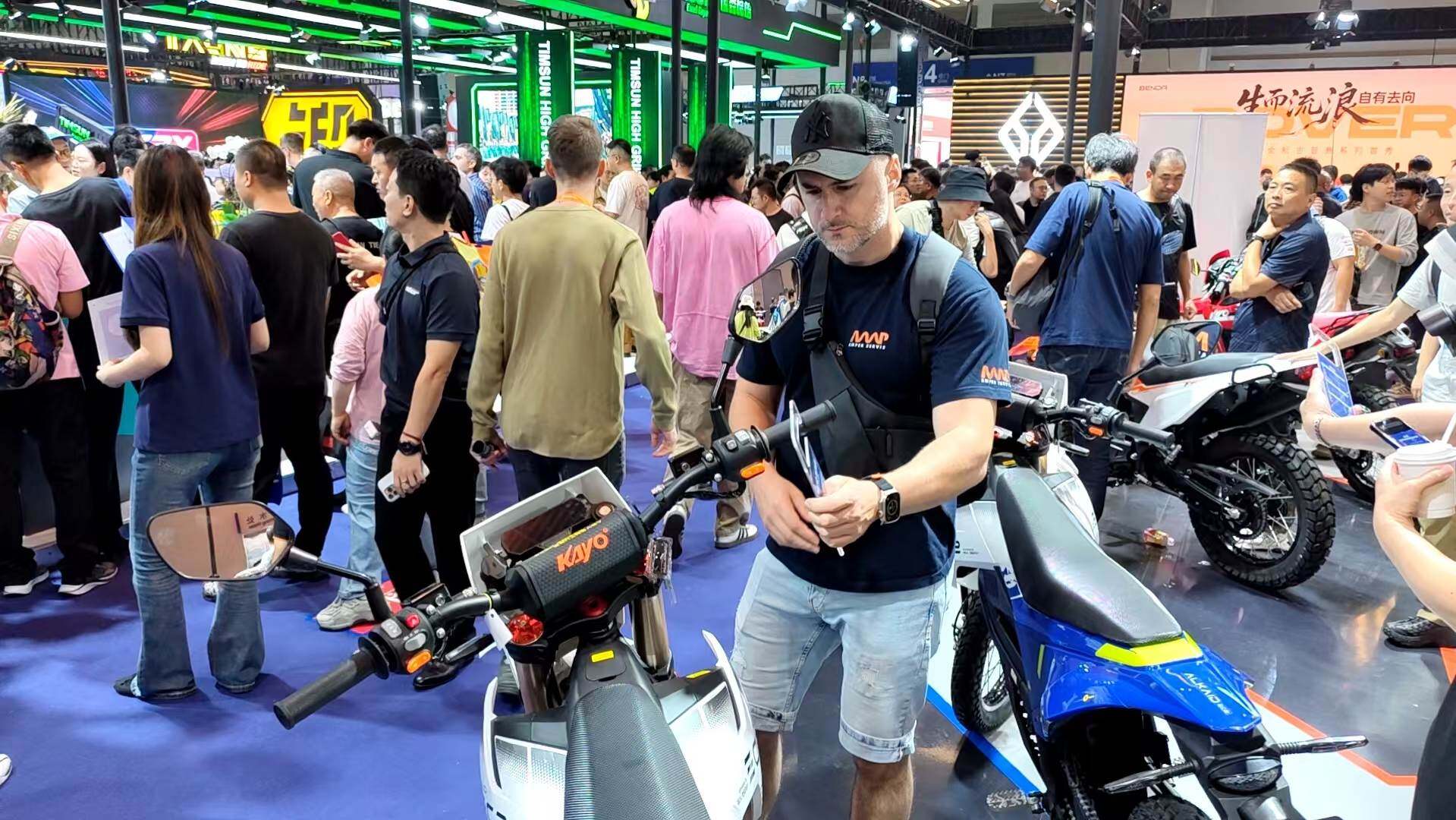 International visitors tour the REAL ENERGY booth.
