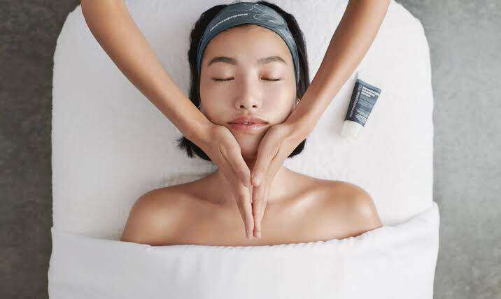 Client receiving Dermalogica facial treatment
