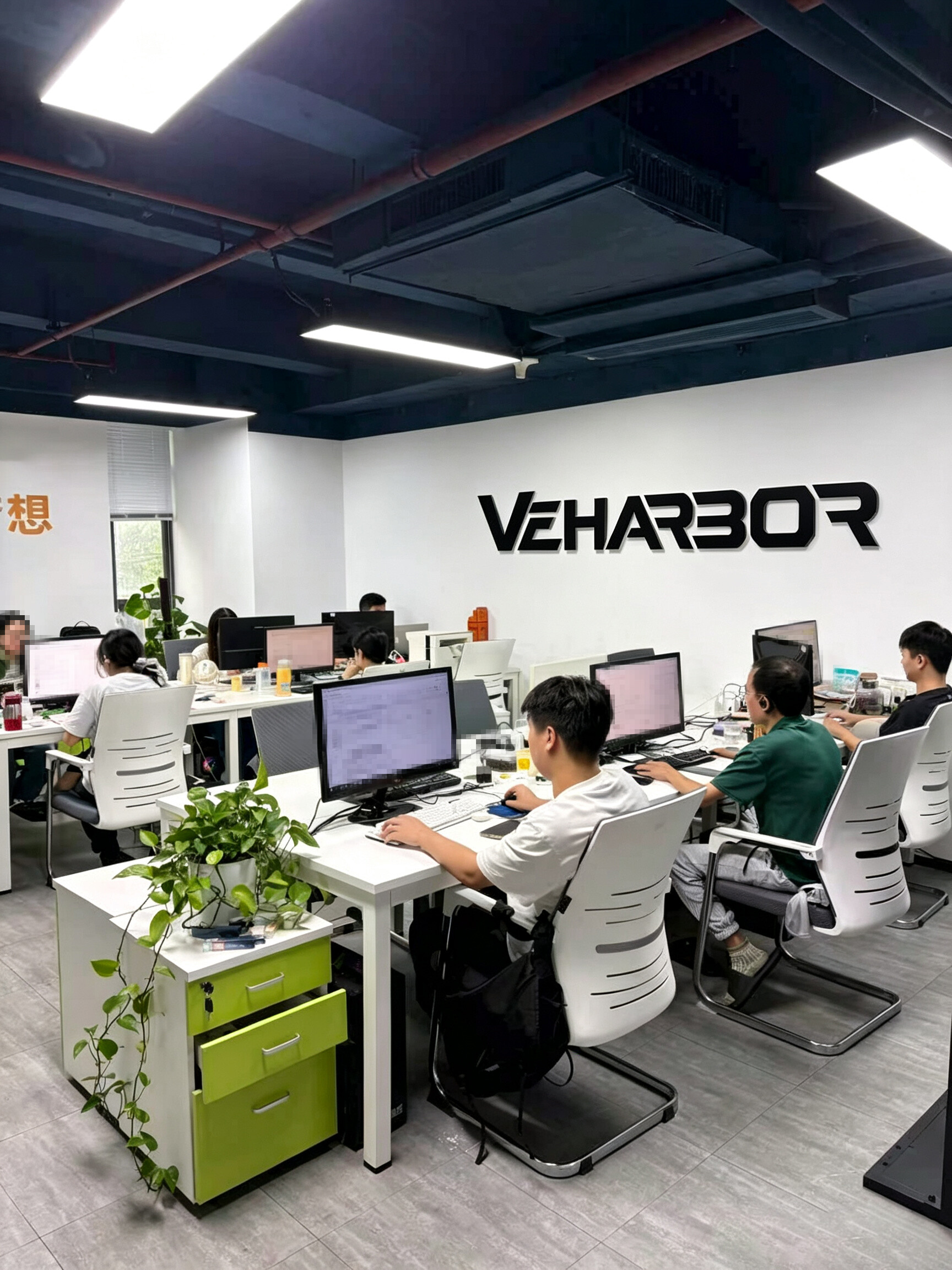 Veharbor employees working at desks