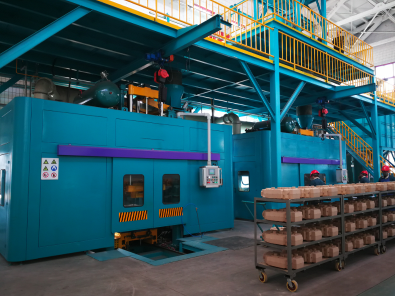 Integrated cold box core making system for foundry core production