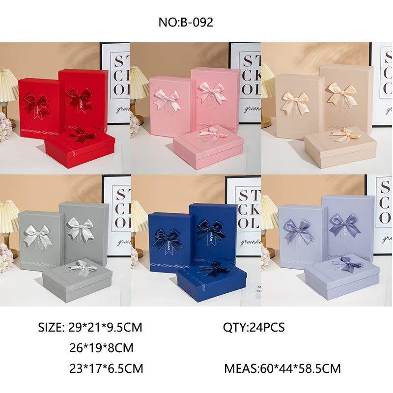 Lined embossed bow-shaped gift box with a cover on all sides