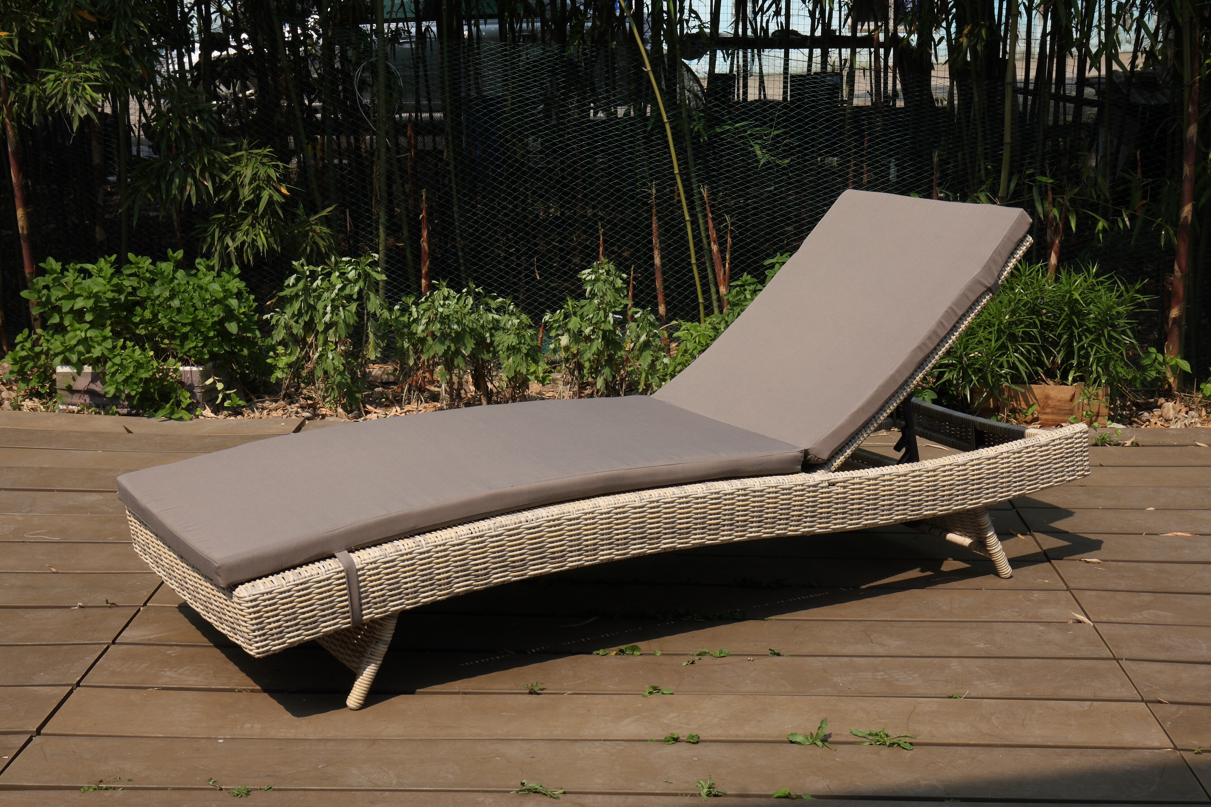 Folding lounger with half round rattan