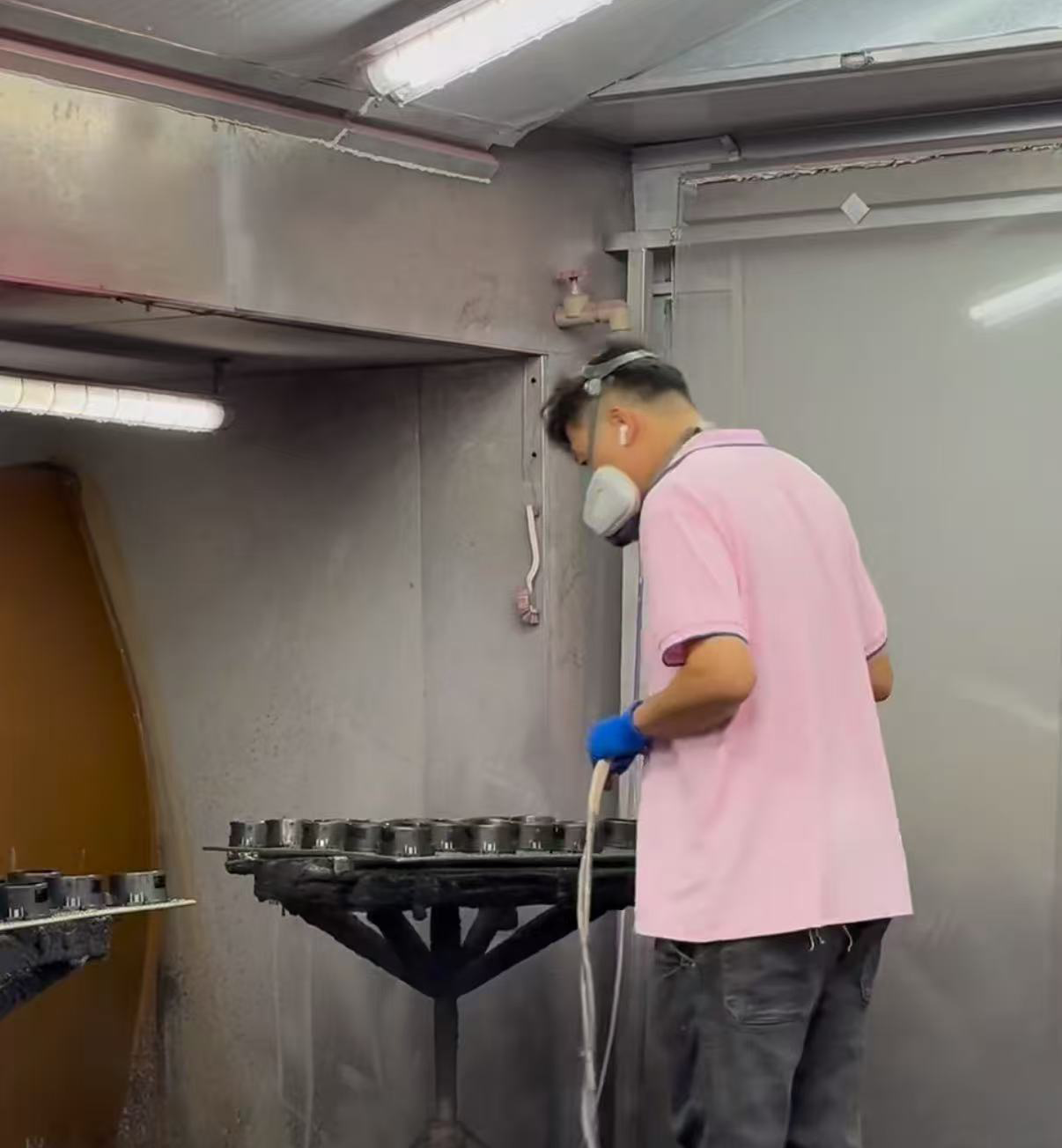 Worker spray painting