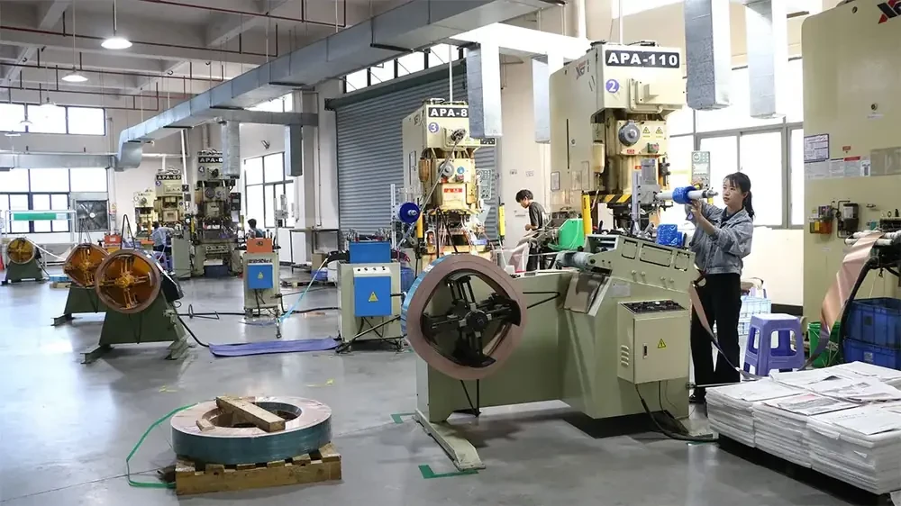 Stamping presses and coil feeder on the precision stamping production line