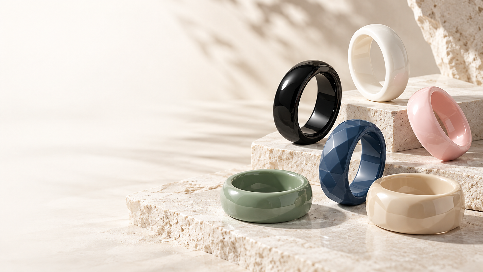 Zirconia ceramic rings in multiple colors on travertine pedestals