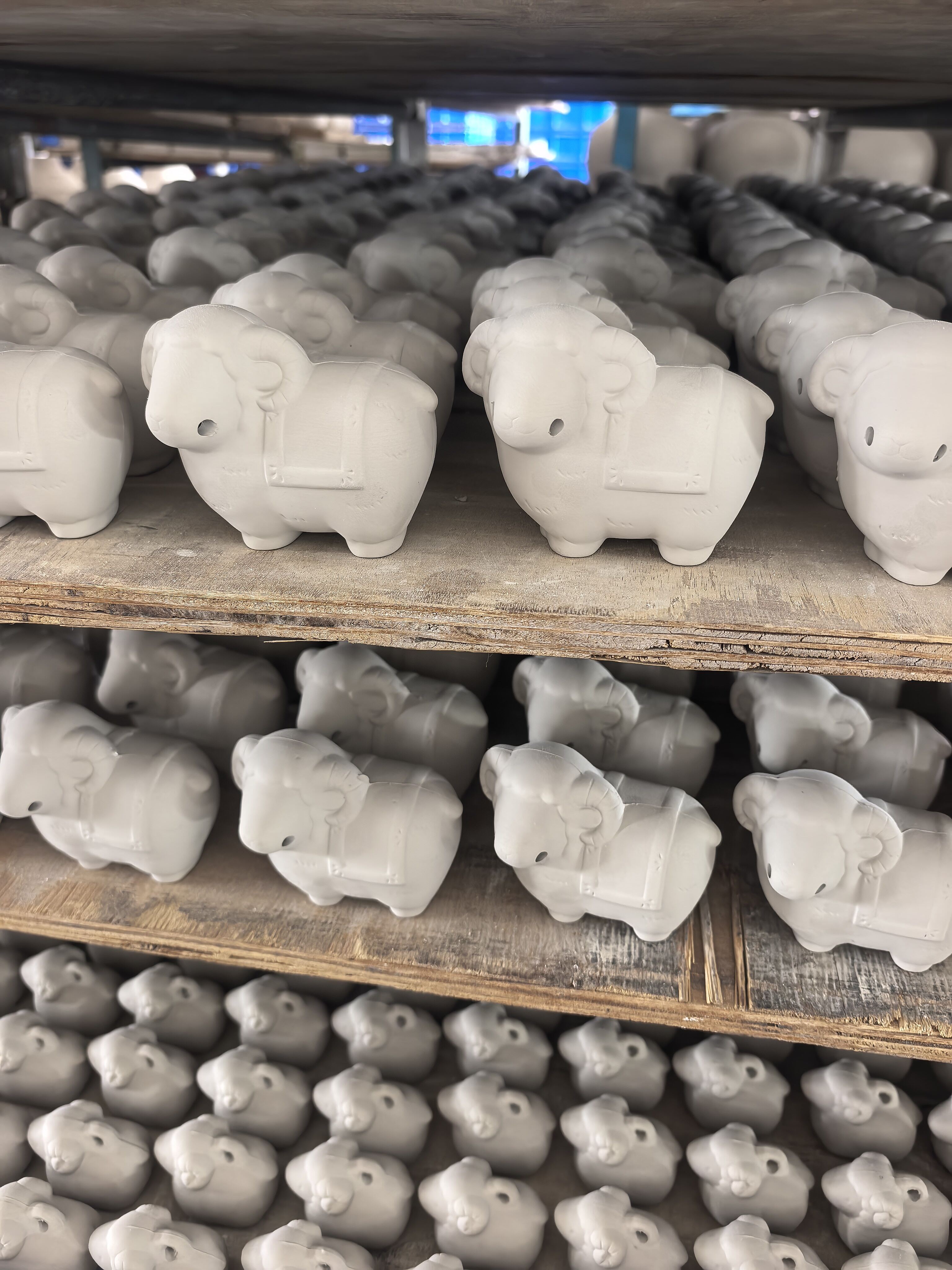 Ceramic sheep figurines on shelves