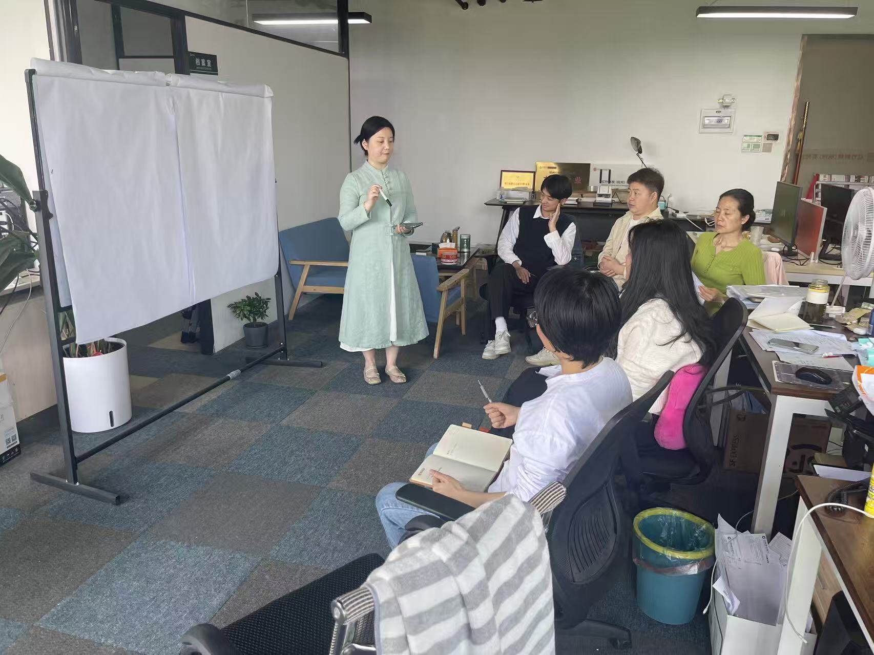 Internal Workshop – Instructor Explaining at Whiteboard