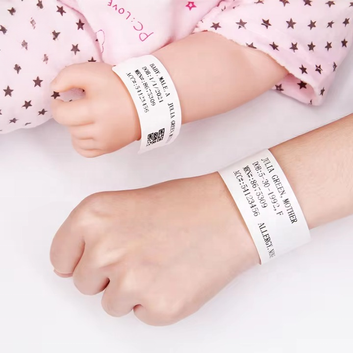 Matching mother and baby identification wristbands with printed patient data and QR code for maternal-infant verification