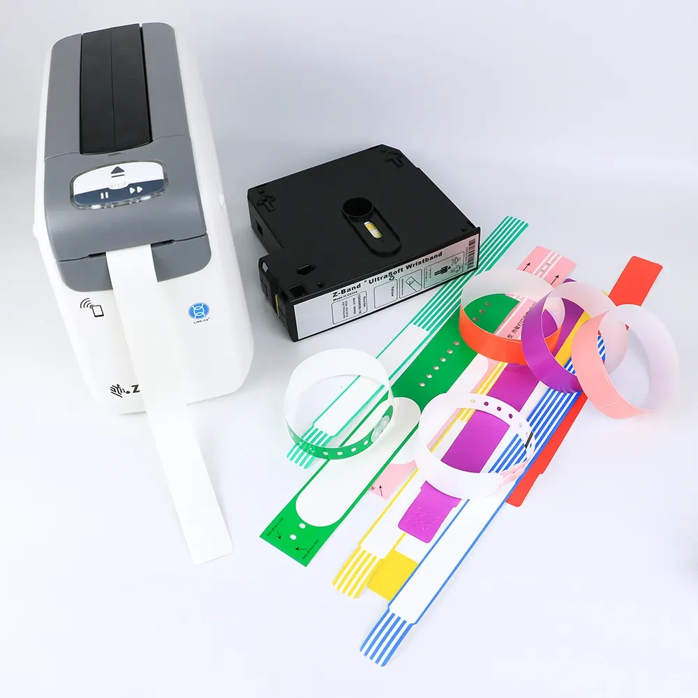 Zebra ZD510-HC wristband printer with colorful wristband rolls stacked