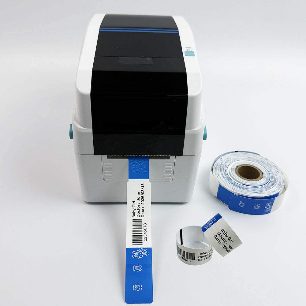 Industrial thermal wristband printer outputting printed newborn patient wristband rolls