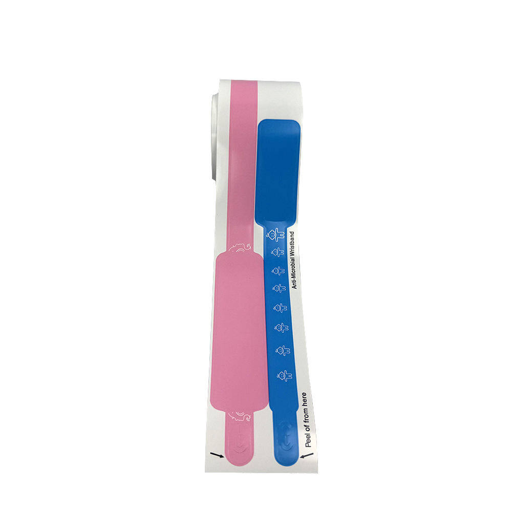 Pink and blue pediatric wristband roll with child-friendly design patterns