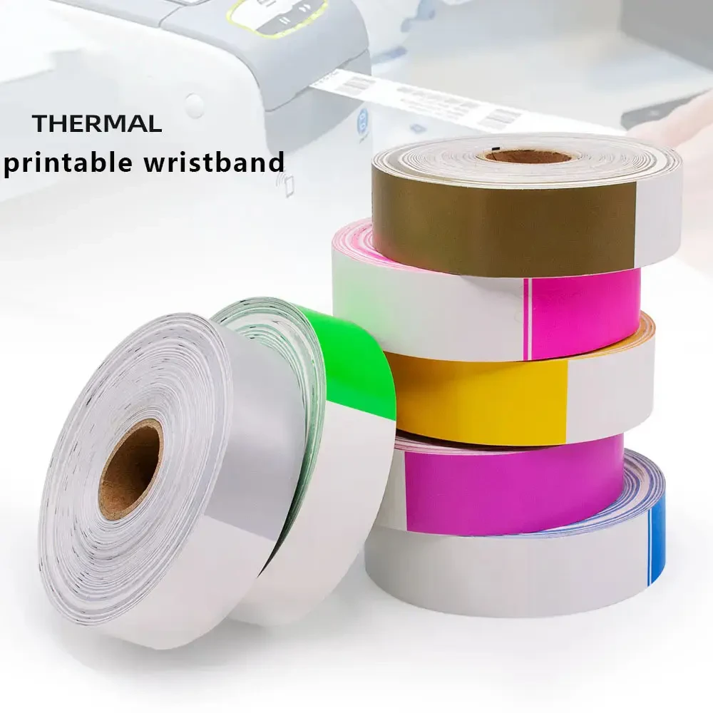 Stacked thermal printable wristband rolls in gold, pink, yellow, magenta and blue