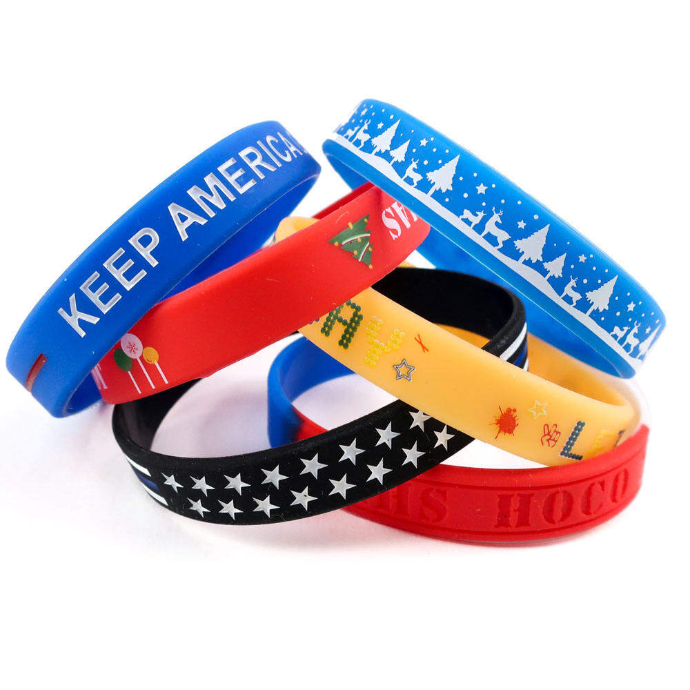 Colorful silicone wristbands with custom text including KEEP AMERICA and Christmas designs