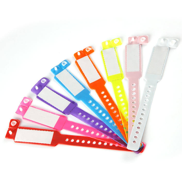 Fan of colorful vinyl patient identification wristbands in red, pink, purple, blue, orange, yellow, and white with snap closures