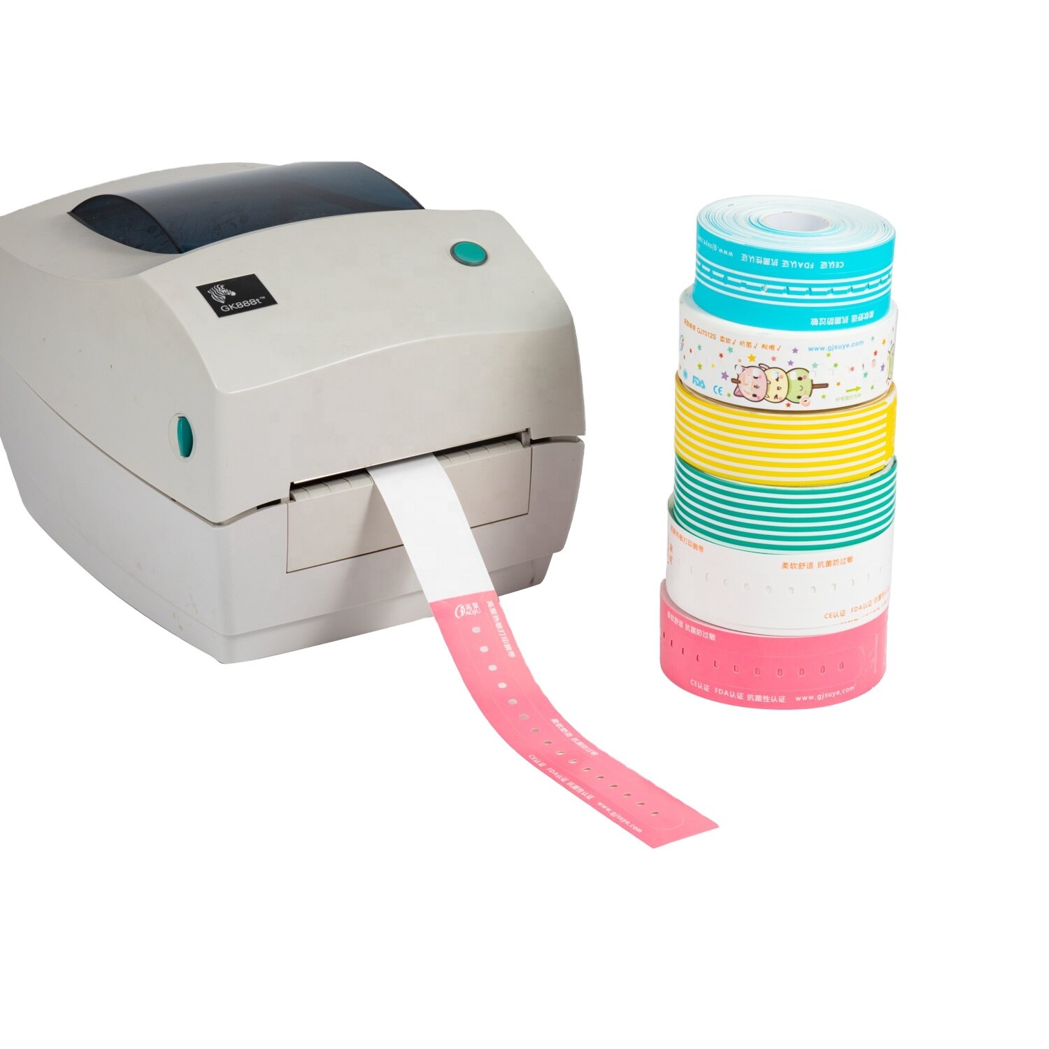 Desktop thermal printer printing a pink patient wristband beside stacked rolls of soft antibacterial wristbands