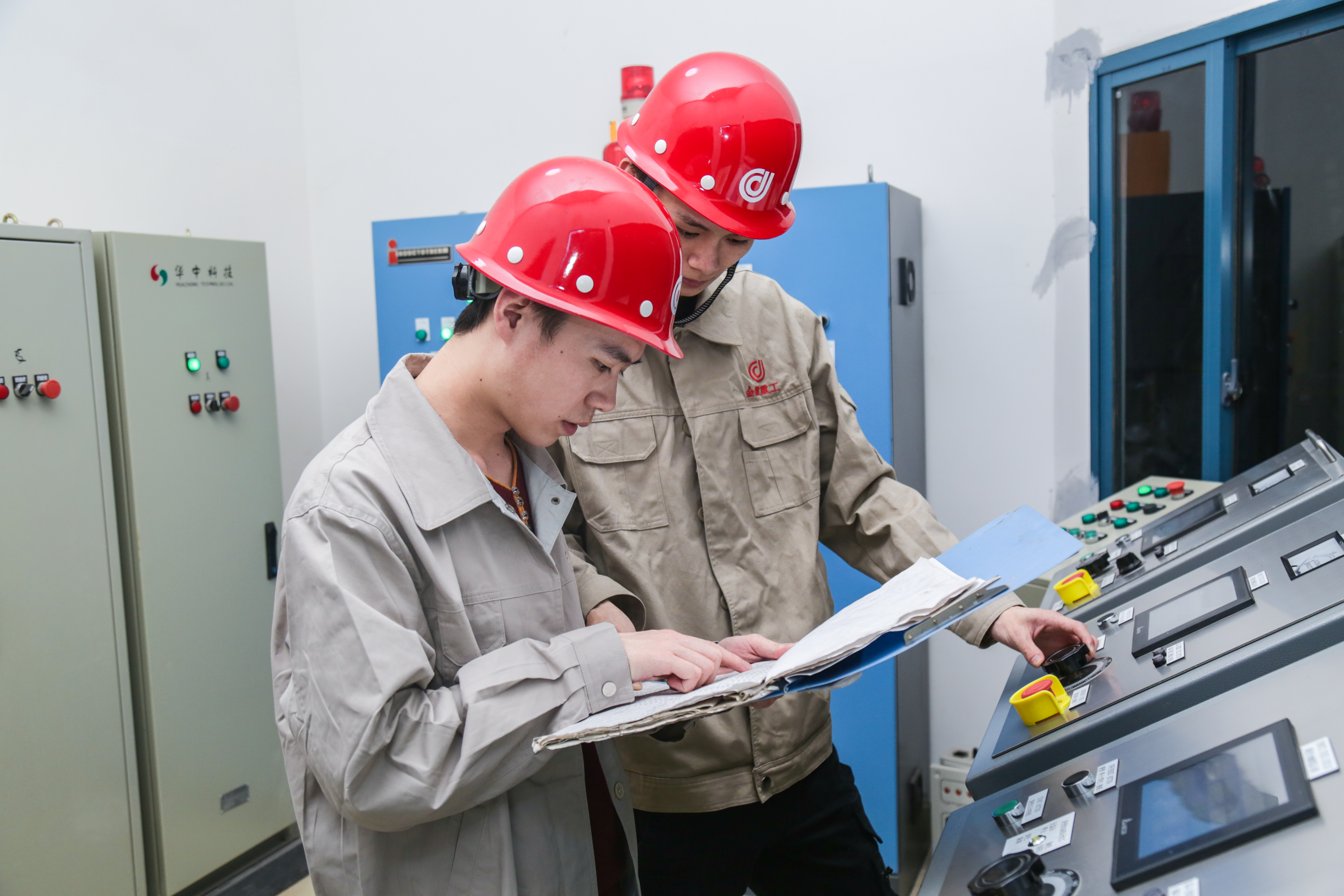 Maintenance engineers working on a heavy shredder machine