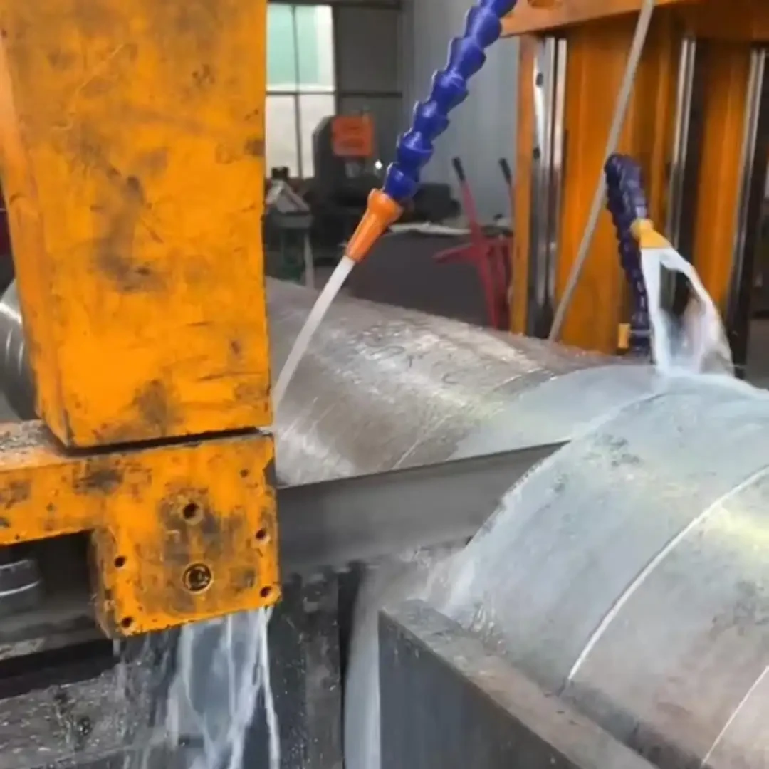 Bandsaw cutting a forged alloy steel section on a production machine