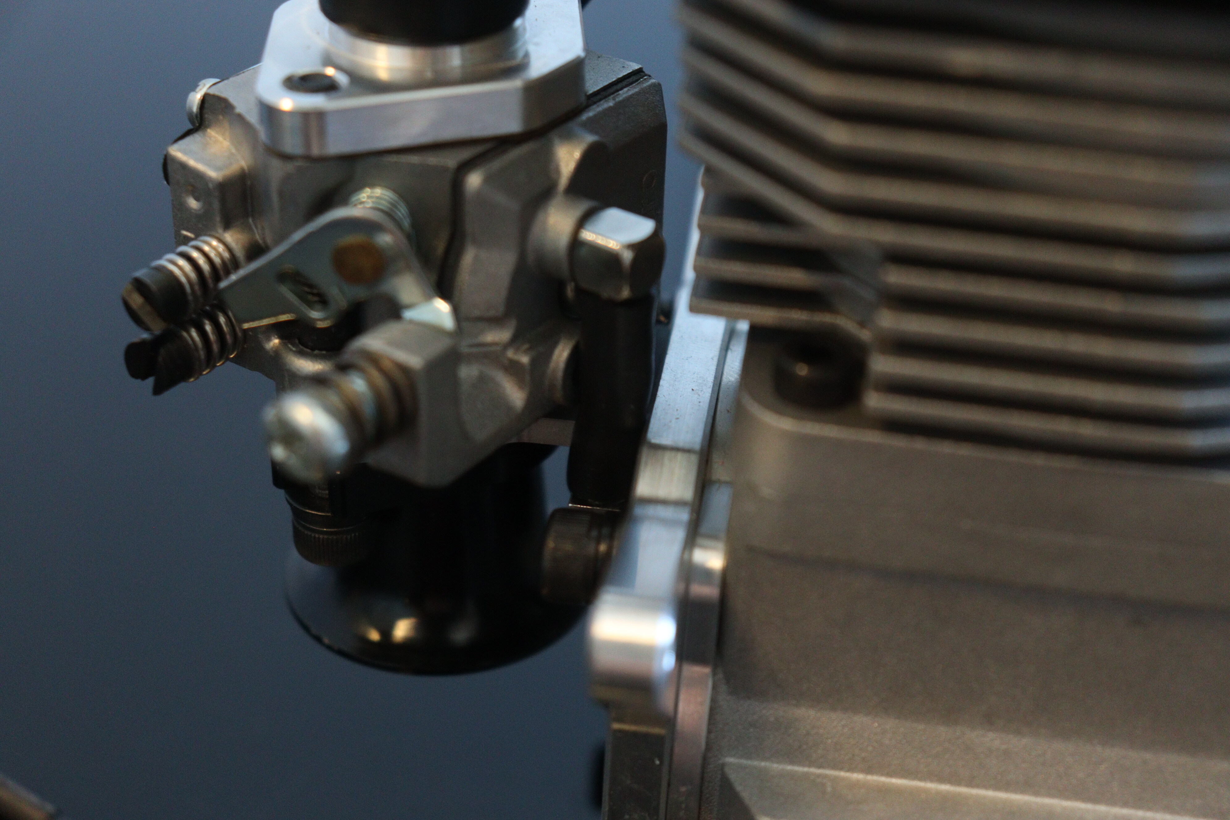 Close-up of carburetor choke adjustment mechanism