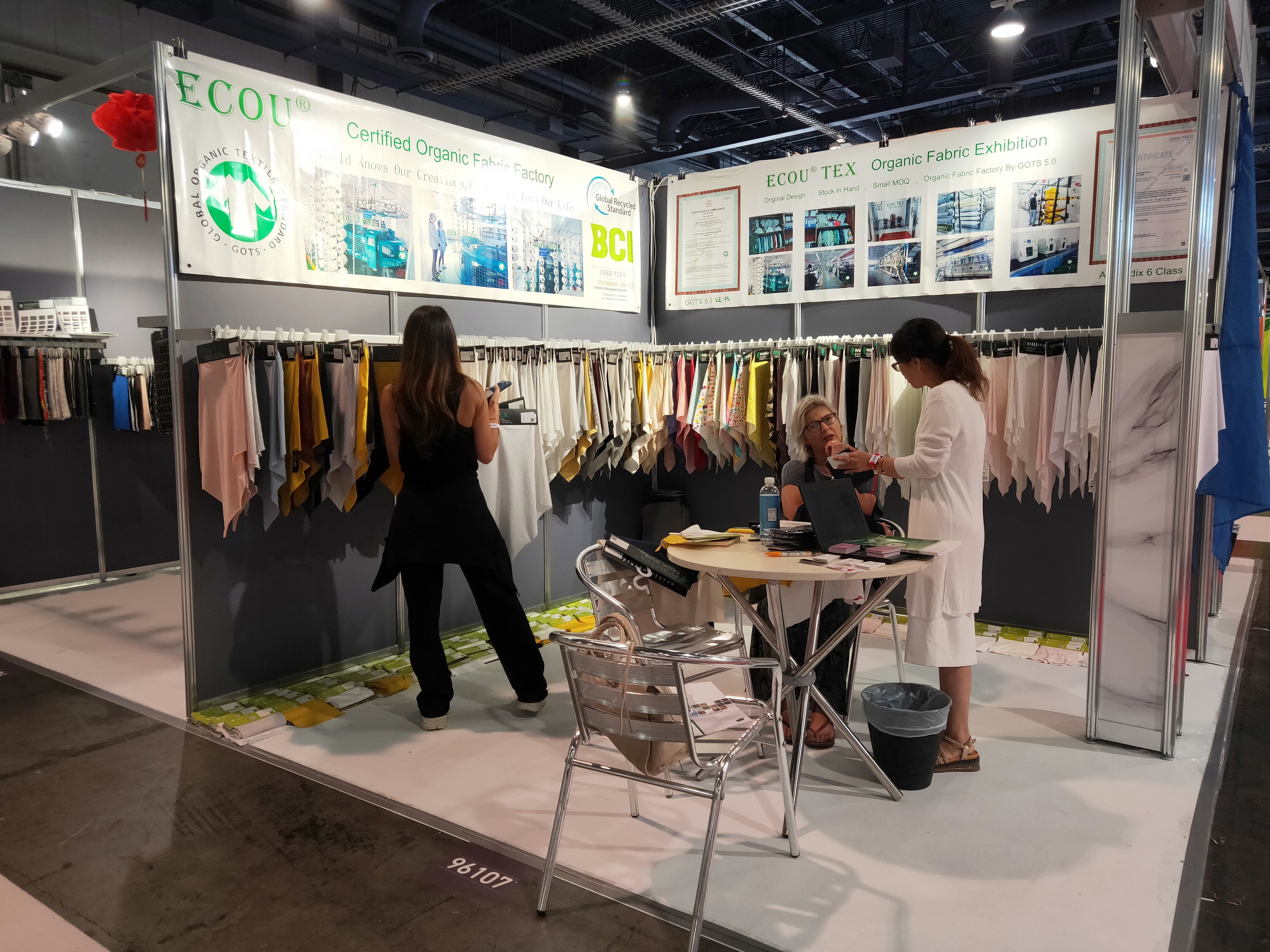Ecou Textiles Booth Customer Consultation Scene