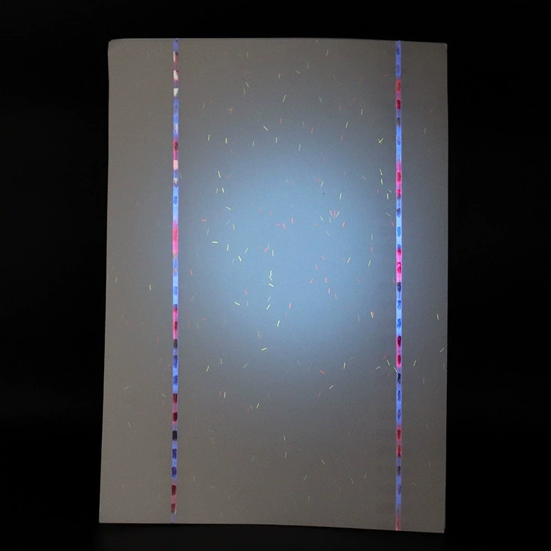 UV-reactive fiber security paper